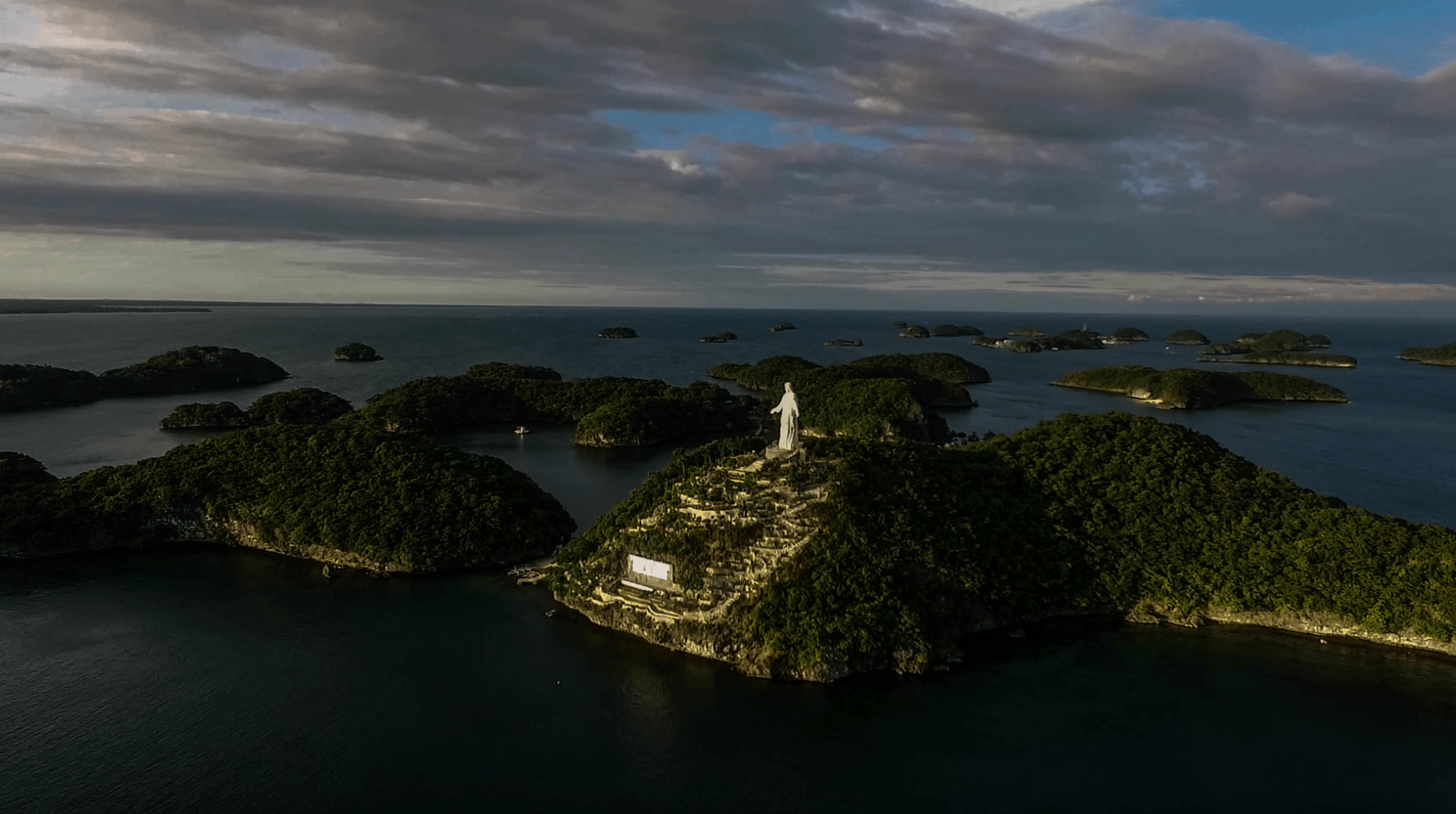 drone image of jesus statue at pilgrimage island in hundred islands pangasinan philippines